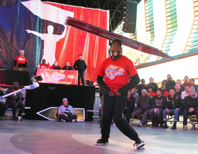 Kadeem Johnson competes at the AArrow Sign Spinning company's championship Saturday, Feb. 23, 2013 at the Fremont Street Experience.